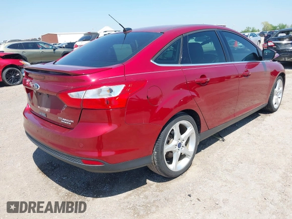 2013 Ford Focus Titanium with VIN 1FADP3J23DL334161, listed as a IAAI auction lot 41987758 with 117,665 mi miles and . Bid and sale history available at carsss.com. Image 4.