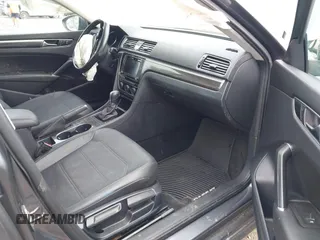 2017 Volkswagen Passat 1.8T SE with VIN 1VWBT7A36HC036977, listed as a IAAI auction lot 40483007 with 64,594 mi miles. Bid and sale history available at carsss.com. Image 5.