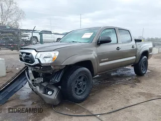2015 Toyota Tacoma with VIN 3TMLU4EN8FM198605, listed as a IAAI auction lot 42039238 with 132,109 mi miles and . Bid and sale history available at DreamBid. Image 2.
