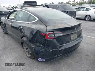 2019 Tesla Model 3 Mid Range with VIN 5YJ3E1EA2KF362048, listed as a IAAI auction lot 40141734 with 70,321 mi miles and . Bid and sale history available at carsss.com. Image 6.