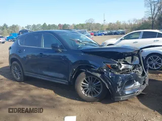 2019 Mazda CX-5 Touring with VIN JM3KFBCM6K0513037, listed as a IAAI auction lot 42121789 with 59,455 mi miles and . Bid and sale history available at DreamBid. Image 13.