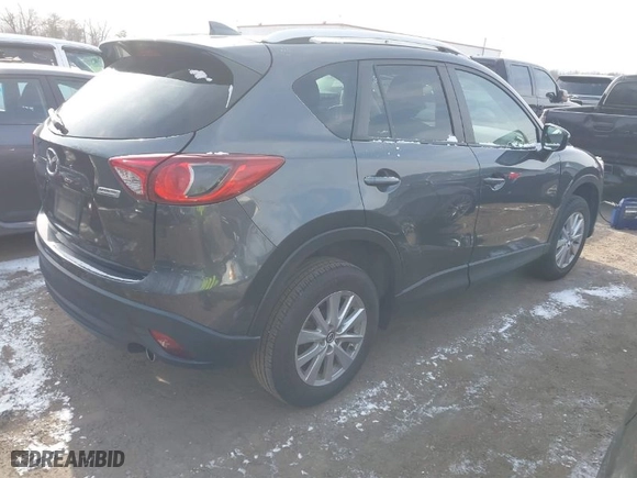 2016 Mazda CX-5 Touring with VIN JM3KE2CY6G0910986, listed as a IAAI auction lot 41619401 with NaN miles. Bid and sale history available at carsss.com. Image 4.