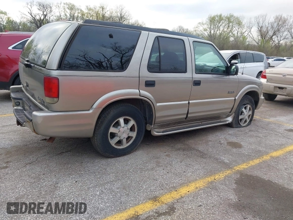 2001 Oldsmobile Bravada z VIN 1GHDT13WX12110603, wystawiony jako IAAI lot #41911383 z przebiegiem 164 916 mil mil oraz . Historia ofert i sprzedaży dostępna na DreamBid. Obrazek 4.