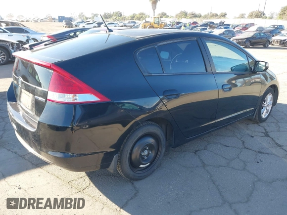 2010 Honda Insight EX with VIN JHMZE2H74AS012517, listed as a IAAI auction lot 41886588 with 227,428 mi miles and . Bid and sale history available at DreamBid. Image 4.