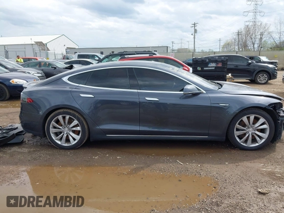 2015 Tesla Model S 85D with VIN 5YJSA1E21FF116775, listed as a IAAI auction lot 41876772 with 128,805 mi miles. Bid and sale history available at carsss.com. Image 14.