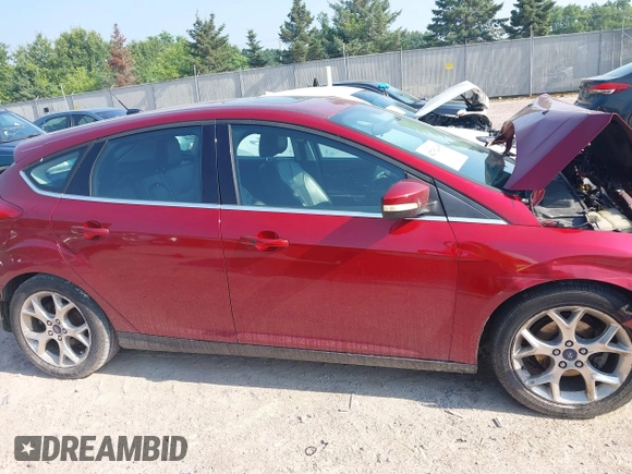 2014 Ford Focus Titanium z VIN 1FADP3N22EL381967, wystawiony jako IAAI lot #42782495 z przebiegiem 160 503 mil mil oraz . Historia ofert i sprzedaży dostępna na DreamBid. Obrazek 13.