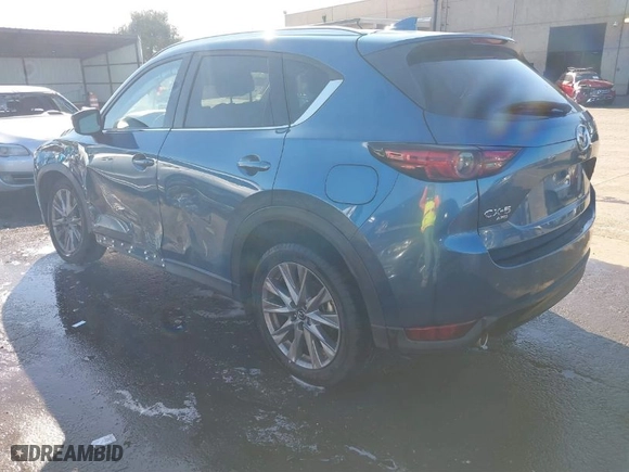 2021 Mazda CX-5 Grand Touring with VIN JM3KFBDM7M0311552, listed as a IAAI auction lot 41856871 with 47,330 mi miles. Bid and sale history available at carsss.com. Image 3.