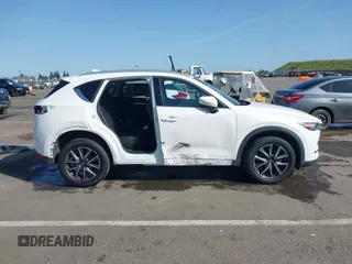 2017 Mazda CX-5 Grand Touring with VIN JM3KFADLXH0222341, listed as a IAAI auction lot 41990464 with 94,374 mi miles and . Bid and sale history available at carsss.com. Image 14.