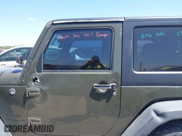 2015 Jeep Wrangler Sport with VIN 1C4AJWAGXFL650428, listed as a IAAI auction lot 42010629 with 80,039 mi miles. Bid and sale history available at carsss.com. Image 14.