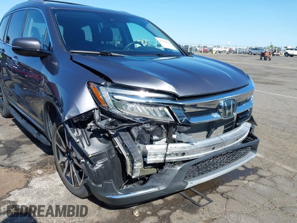 2021 Honda Pilot Touring 8-Passenger with VIN 5FNYF6H97MB034399, listed as a IAAI auction lot 42303419 with 50,034 mi miles and . Bid and sale history available at DreamBid. Image 6.