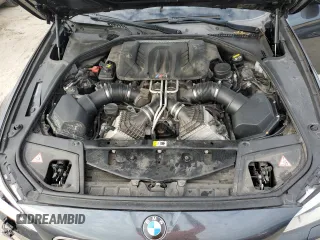 2016 BMW M5 z VIN WBSFV9C51GD595430, wystawiony jako Copart lot #79675834 z przebiegiem 82 351 mil mil oraz Szkoda całkowita • Salvage title. Historia ofert i sprzedaży dostępna na DreamBid. Obrazek 11.