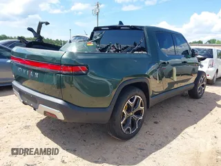 2023 Rivian R1T Adventure z VIN 7FCTGAAAXPN019894, wystawiony jako IAAI lot #42168226 z przebiegiem 23 380 mil mil oraz . Historia ofert i sprzedaży dostępna na DreamBid. Obrazek 4.