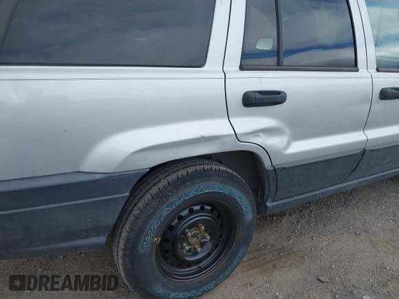 2004 Jeep Grand Cherokee Laredo with VIN 1J4GW48N14C434351, listed as a IAAI auction lot 41860077 with 152,404 mi miles and . Bid and sale history available at DreamBid. Image 6.