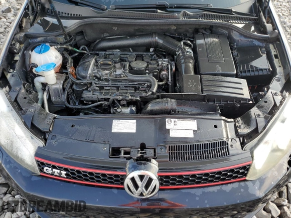 2012 Volkswagen GTI w/Conv & Sunroof z VIN WVWEV7AJ1CW090672, wystawiony jako Copart lot #71884774 z przebiegiem 116 996 mil mil oraz Szkoda całkowita • Salvage title. Historia ofert i sprzedaży dostępna na DreamBid. Obrazek 11.