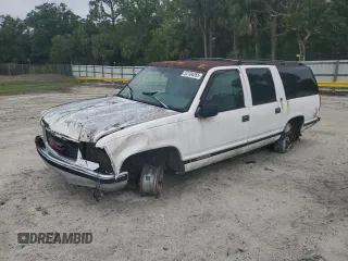 1997 GMC Suburban with VIN 1GKEC16R9VJ728883, listed as a Copart auction lot 52104265 with 246,816 mi miles and Salvage Title. Bid and sale history available at carsss.com. Image 1.