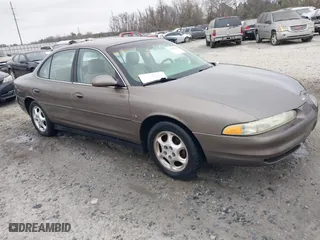 1999 Oldsmobile Intrigue GLS with VIN 1G3WX52H6XF321750, listed as a IAAI auction lot 41505500 with 180,036 mi miles. Bid and sale history available at carsss.com. Image 1.