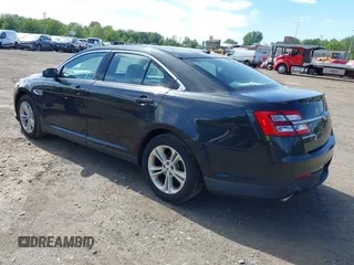 2015 Ford Taurus SEL with VIN 1FAHP2E88FG181055, listed as a IAAI auction lot 42307640 with 104,702 mi miles and . Bid and sale history available at DreamBid. Image 3.