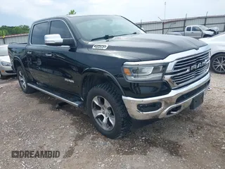 2020 Ram 1500 Laramie with VIN 1C6SRFJT4LN150587, listed as a IAAI auction lot 42459574 with 54,130 mi miles and . Bid and sale history available at DreamBid. Image 1.
