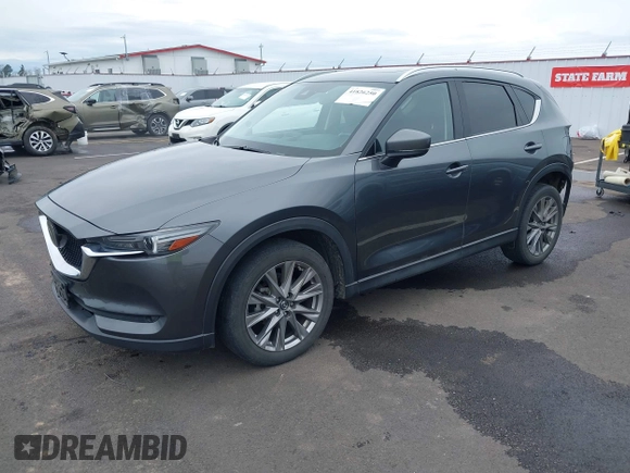 2020 Mazda CX-5 Grand Touring with VIN JM3KFBDM4L0829861, listed as a IAAI auction lot 41826250 with 62,091 mi miles and . Bid and sale history available at carsss.com. Image 18.