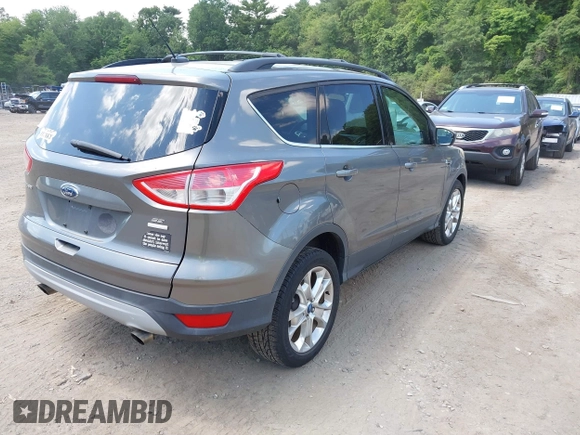 2013 Ford Escape SE with VIN 1FMCU9GXXDUA97162, listed as a IAAI auction lot 42633382 with 74,375 mi miles and . Bid and sale history available at DreamBid. Image 4.