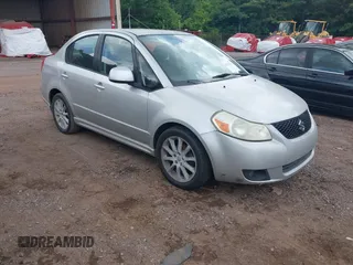 2009 Suzuki SX4 Sport FWD z VIN JS2YC414896203415, wystawiony jako IAAI lot #42473171 z przebiegiem 195 865 mil mil oraz . Historia ofert i sprzedaży dostępna na DreamBid. Obrazek 1.