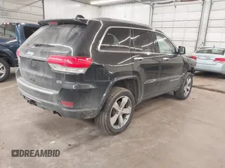2014 Jeep Grand Cherokee Overland with VIN 1C4RJFCG8EC177899, listed as a IAAI auction lot 41695290 with 200,867 mi miles and . Bid and sale history available at DreamBid. Image 4.