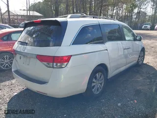 2016 Honda Odyssey EX-L with VIN 5FNRL5H62GB051628, listed as a IAAI auction lot 41911509 with 128,281 mi miles. Bid and sale history available at carsss.com. Image 4.