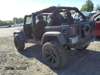 2015 Jeep Wrangler Unlimited Freedom with VIN 1C4BJWDG8FL689194, listed as a Copart auction lot 58016385 with 108,026 mi miles and Salvage title. Bid and sale history available at DreamBid. Image 2.