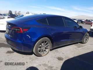 2023 Tesla Model 3 with VIN 5YJ3E1EA5PF652212, listed as a Copart auction lot 57348395 with 8,780 mi miles and Salvage title. Bid and sale history available at DreamBid. Image 3.