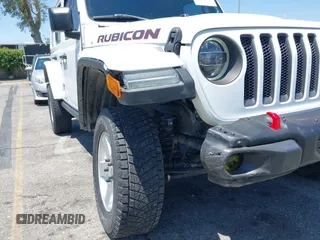 2018 Jeep Wrangler Unlimited Rubicon with VIN 1C4HJXFN8JW215023, listed as a IAAI auction lot 42227099 with 62,195 mi miles and . Bid and sale history available at DreamBid. Image 6.