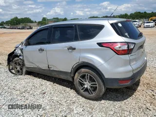 2018 Ford Escape S with VIN 1FMCU0F78JUB79464, listed as a Copart auction lot 58812925 with 104,642 mi miles and Salvage title. Bid and sale history available at DreamBid. Image 2.