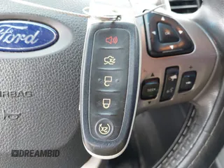2015 Ford Taurus Limited with VIN 1FAHP2J84FG110702, listed as a IAAI auction lot 42060437 with 208,012 mi miles. Bid and sale history available at carsss.com. Image 11.