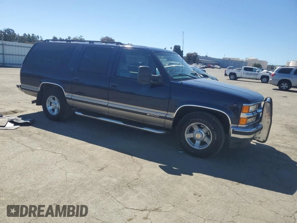 1999 Chevrolet Suburban with VIN 1GNEC16R1XJ394144, listed as a Copart auction lot 50418185 with 173,037 mi miles and Salvage title. Bid and sale history available at DreamBid. Image 4.