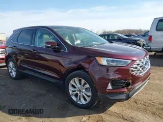 2021 Ford Edge Titanium z VIN 2FMPK4K93MBA44120, wystawiony jako IAAI lot #41826169 z przebiegiem 19 601 mil mil oraz . Historia ofert i sprzedaży dostępna na DreamBid. Obrazek 1.
