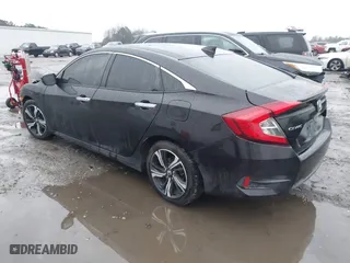 2017 Honda Civic Sedan Touring with VIN 2HGFC1F99HH658034, listed as a IAAI auction lot 41563627 with 140,819 mi miles. Bid and sale history available at carsss.com. Image 3.