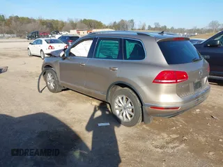 2016 Volkswagen Touareg Sport with VIN WVGEF9BP0GD003241, listed as a IAAI auction lot 41498797 with 90,141 mi miles and . Bid and sale history available at DreamBid. Image 3.