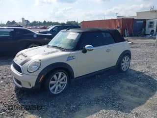 2010 MINI Convertible S with VIN WMWMS3C58ATY09098, listed as a IAAI auction lot 42149773 with 127,424 mi miles and . Bid and sale history available at DreamBid. Image 2.