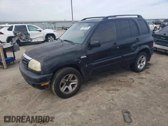 2003 Suzuki Grand Vitara z VIN JS3TE62V834101506, wystawiony jako Copart lot #47094765 z przebiegiem 240 778 mil mil oraz Szkoda całkowita • Salvage title. Historia ofert i sprzedaży dostępna na DreamBid. Obrazek 1.