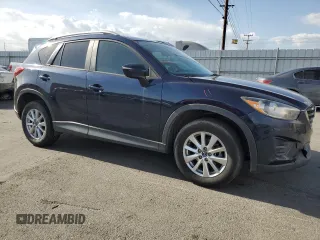 2016 Mazda CX-5 Sport with VIN JM3KE2BY0G0730906, listed as a Copart auction lot 51611865 with 207,166 mi miles and Salvage Title. Bid and sale history available at carsss.com. Image 4.