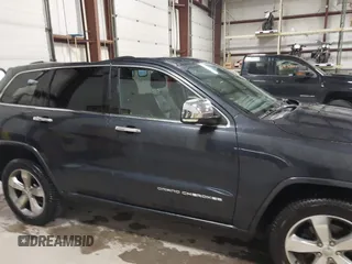 2014 Jeep Grand Cherokee Overland with VIN 1C4RJFCT9EC234270, listed as a IAAI auction lot 41938621 with 144,541 mi miles and . Bid and sale history available at DreamBid. Image 13.
