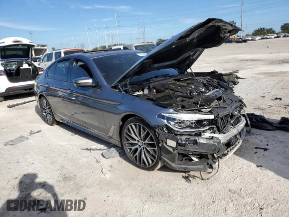 2018 BMW 5 Series M550i xDrive with VIN WBAJB9C53JB034947, listed as a Copart auction lot 77270534 with Not provided miles and Non repairable. Bid and sale history available at DreamBid. Image 4.