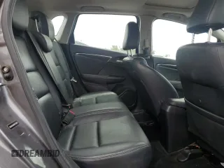 2015 Honda Fit EX-L z VIN 3HGGK5H8XFM776885, wystawiony jako Copart lot #57298225 z przebiegiem Nie podano mil oraz Szkoda całkowita • Salvage title. Historia ofert i sprzedaży dostępna na DreamBid. Obrazek 10.