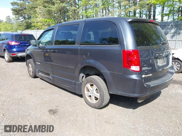 2013 Dodge Grand Caravan SXT with VIN 2C4RDGCG4DR636798, listed as a IAAI auction lot 42240550 with 96,100 mi miles and . Bid and sale history available at DreamBid. Image 3.