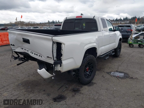 2022 Toyota Tacoma SR with VIN 3TYSX5EN1NT010664, listed as a IAAI auction lot 41642295 with 29,848 mi miles and . Bid and sale history available at DreamBid. Image 4.