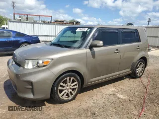 2012 Scion xB with VIN JTLZE4FE3C1144356, listed as a Copart auction lot 48751865 with 156,959 mi miles and Clean Title. Bid and sale history available at carsss.com. Image 1.