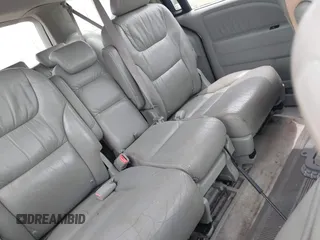 2005 Honda Odyssey EX-L z VIN 5FNRL38645B115699, wystawiony jako IAAI lot #42212481 z przebiegiem 236 420 mil mil oraz . Historia ofert i sprzedaży dostępna na DreamBid. Obrazek 8.