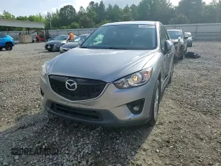 2014 Mazda CX-5 Touring z VIN JM3KE2CY0E0412733, wystawiony jako Copart lot #55803865 z przebiegiem 161 539 mil mil oraz Szkoda całkowita • Salvage title. Historia ofert i sprzedaży dostępna na DreamBid. Obrazek 14.