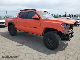 2023 Toyota Tacoma 4WD SR with VIN 3TYCZ5AN8PT162433, listed as a Copart auction lot 52911055 with 7,321 mi miles and Salvage Title. Bid and sale history available at carsss.com. Image 4.