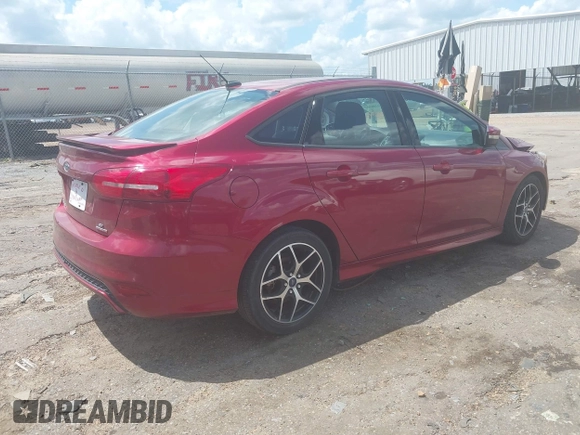 2015 Ford Focus SE z VIN 1FADP3F25FL313033, wystawiony jako IAAI lot #42206507 z przebiegiem 142 938 mil mil oraz . Historia ofert i sprzedaży dostępna na DreamBid. Obrazek 4.