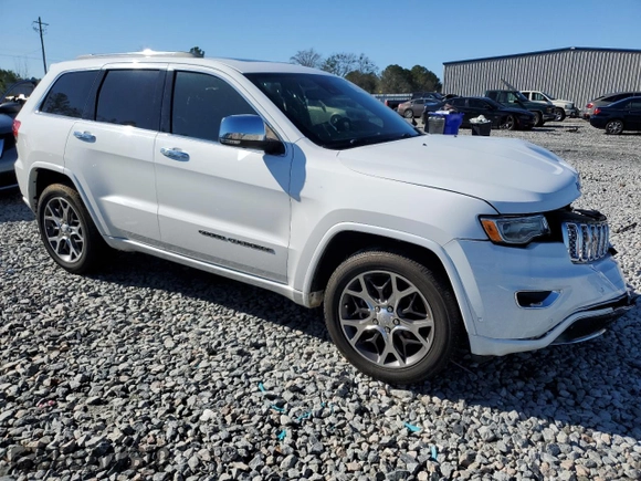 2019 Jeep Grand Cherokee Overland with VIN 1C4RJECG2KC543474, listed as a Copart auction lot 87354084 with 86,076 mi miles and Salvage Title. Bid and sale history available at carsss.com. Image 4.